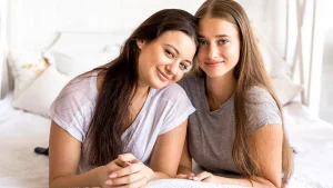 Same-sex female couple consulting a fertility specialist about IVF success rates and family-building options.