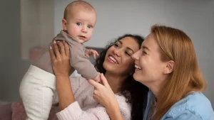 Same-sex couple consulting a fertility specialist about legal rights after IVF in the UK.